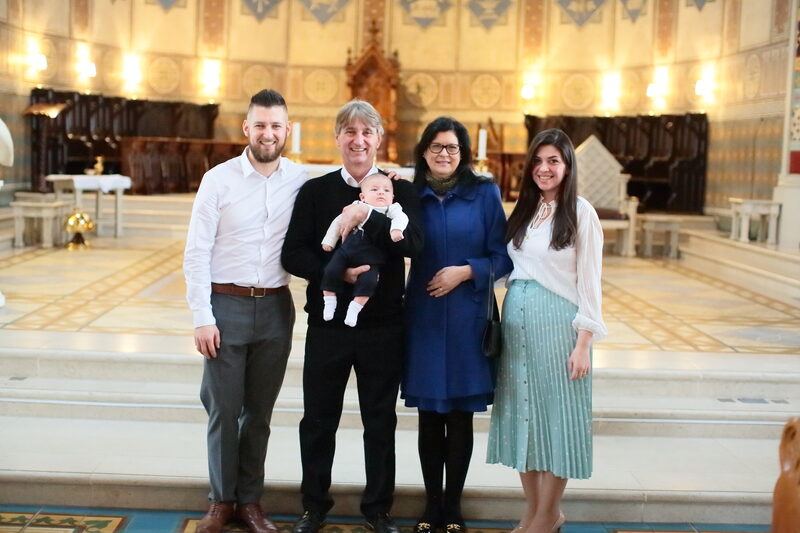 Tom&aacute;s in the arms of Grandpa Algildo and Grandma-of-the-heart S&ocirc;nia